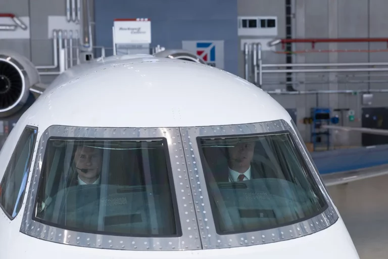 A flight crew readying a business jet for a flight.